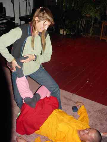 ALT =[“Dr. Jolie Bookspan: Showing Thai massage techniques to Senior Monk Lama Tenzing of the Tibetan Medical School”] 