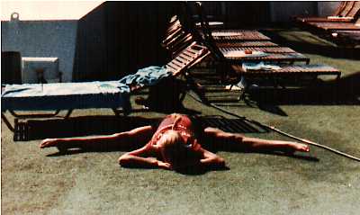 ALT =[“Dr. Jolie Bookspan: Pioneered putting fitness on cruise ships. Pictured here stretching on deck”] 